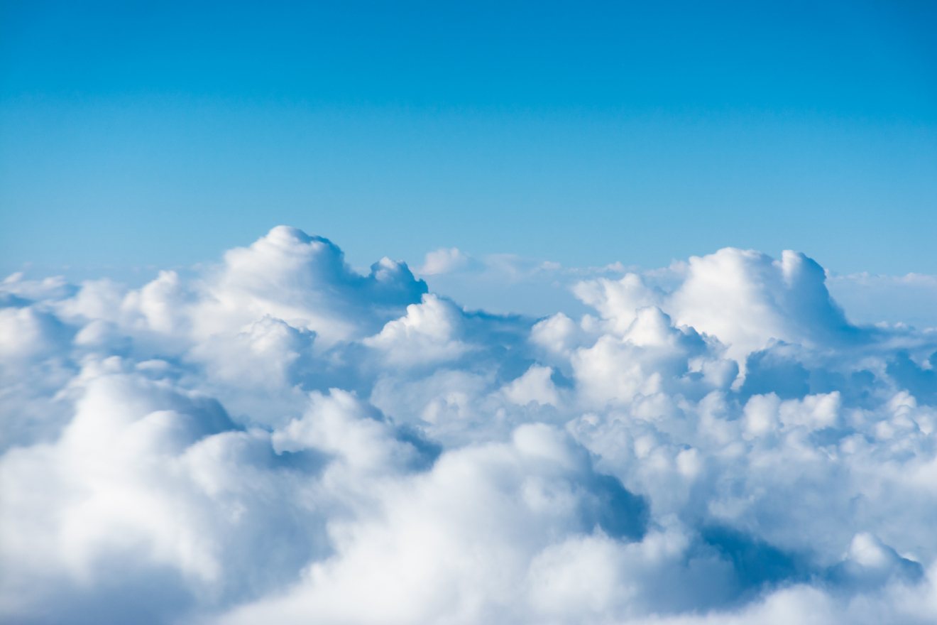 flight over the clouds. view of the clouds from the airplane win - NUSTEM