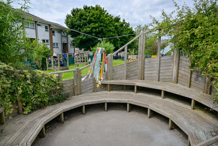 Windsock hanging from a washing line in a school garden.