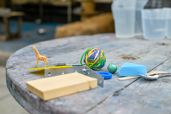 A variety of plastic, wooden, metal and rubber objects to test and sort